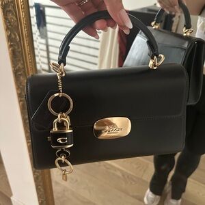 Coach Eliza Top Handle bag in black and gold tone hardware